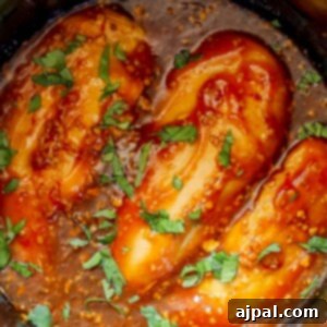 Sticky Honey Garlic Slow Cooker Chicken Breasts 8 Slow cooker chicken with garlic and honey sauce.