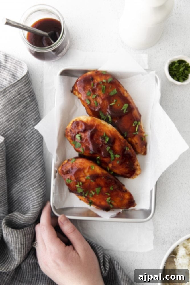 Tender Air Fryer BBQ Chicken Breasts 3 Air fryer BBQ chicken breasts with rice and sauce.
