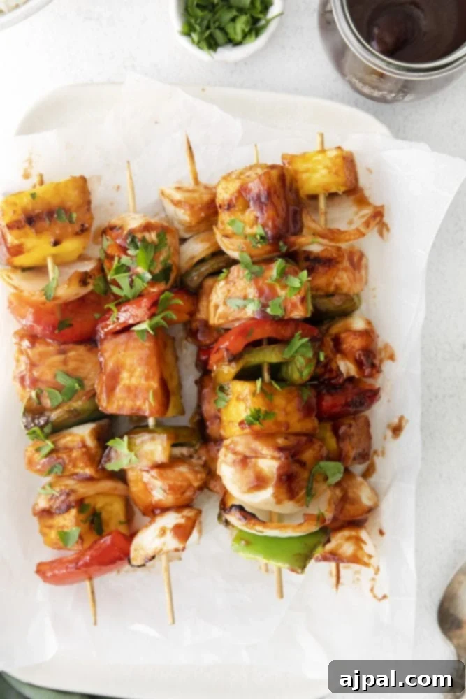 picture of huli huli chicken kebob on a white plate