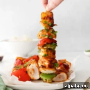 picture of huli huli chicken kebob on a white plate
