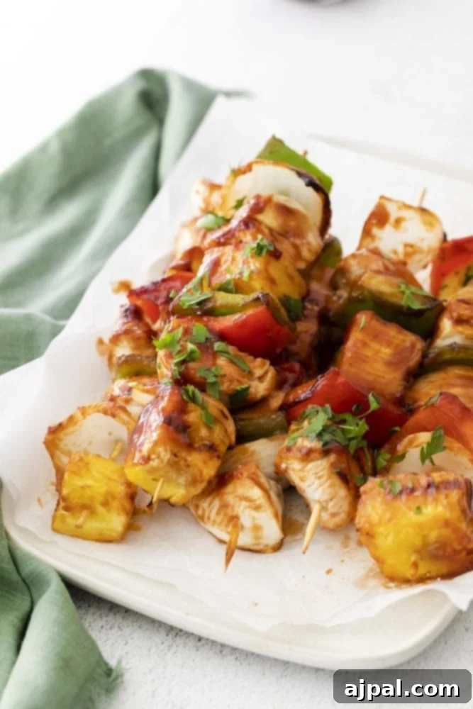 picture of huli huli chicken kebob on a white plate