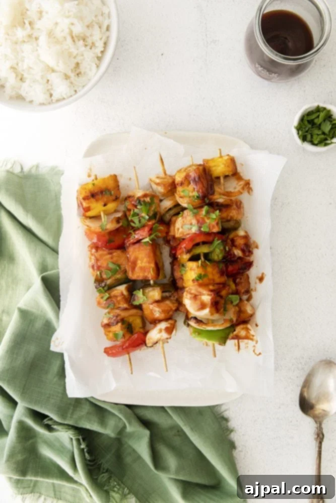 picture of huli huli chicken kebob on a white plate