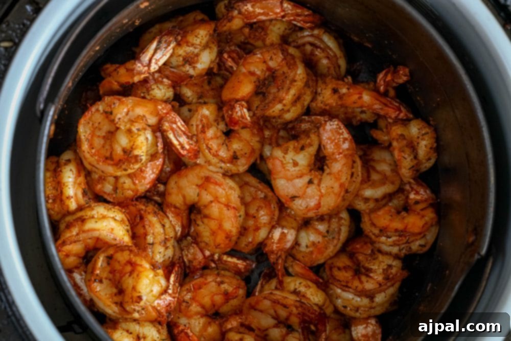 Perfectly Blackened Air Fryer Shrimp 3 Shrimp cooked in an air fryer.