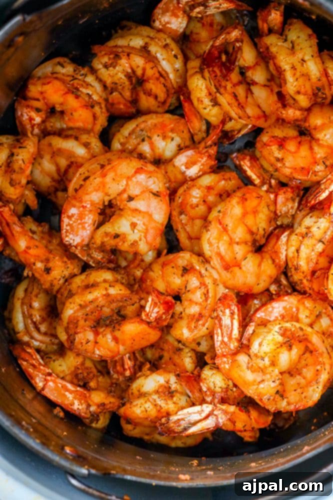 Perfectly Blackened Air Fryer Shrimp 5 Shrimp cooked in an air fryer.