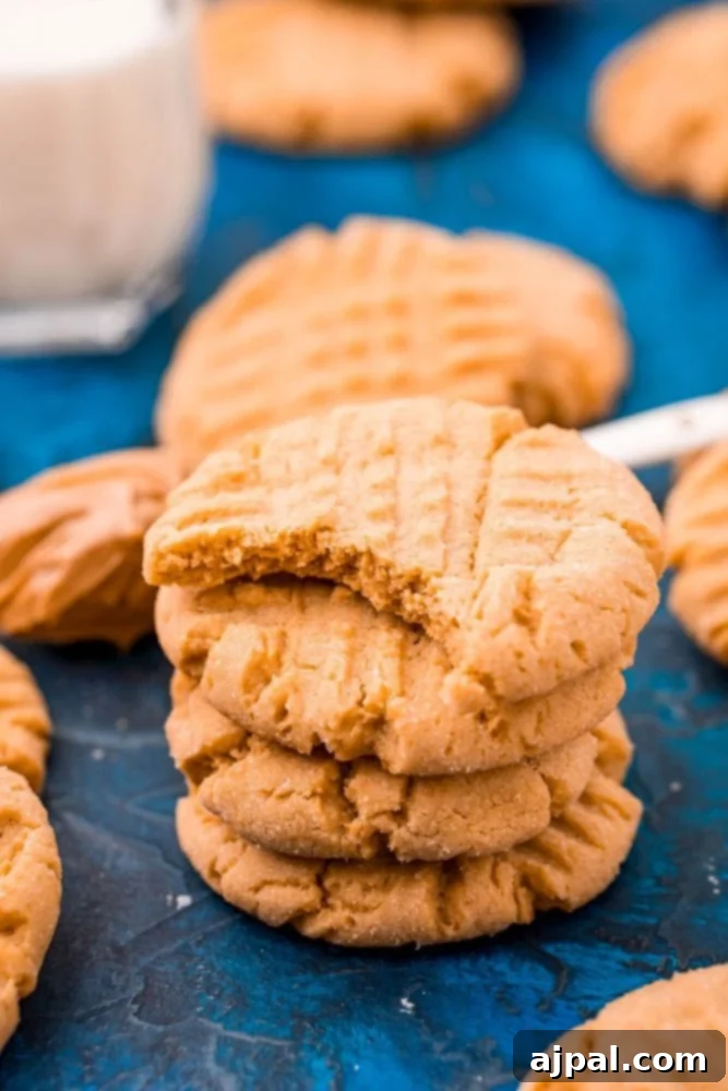 picture of peanut butter cookies stacked on a blue table
