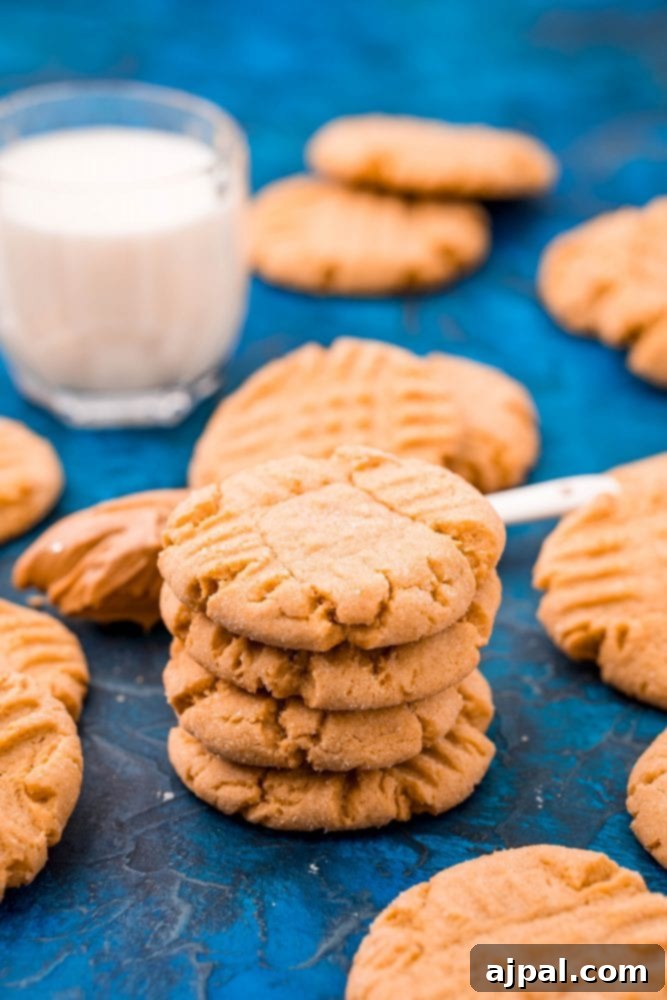 picture of peanut butter cookies stacked on a blue table