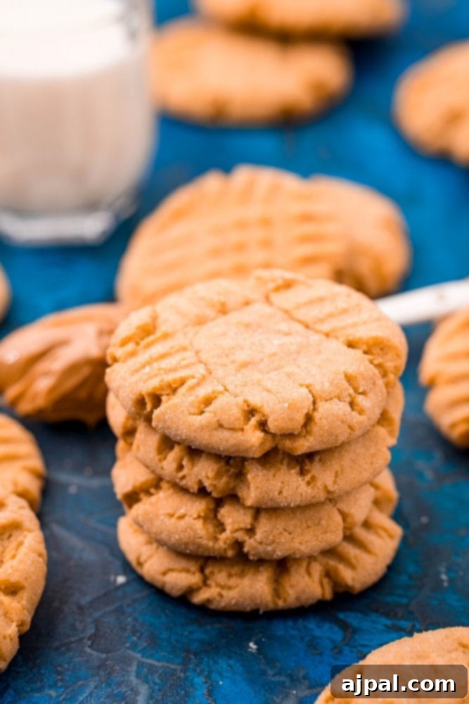 picture of peanut butter cookies stacked on a blue table