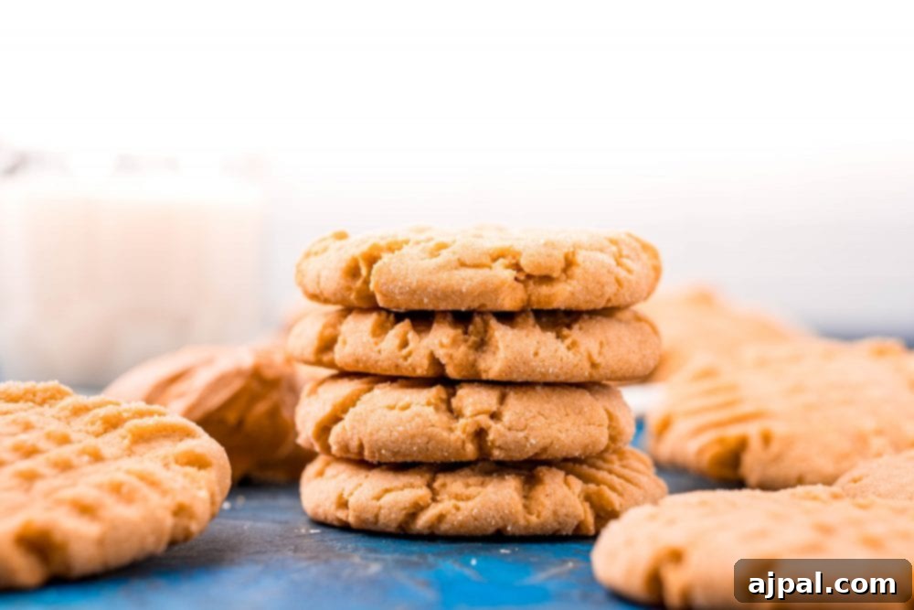 picture of peanut butter cookies stacked on a blue table