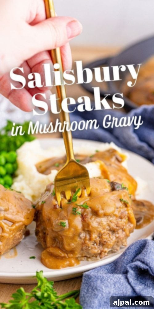 Rich Salisbury Steaks with Velvety Mushroom Gravy 8 A close-up of a plated Salisbury steak in mushroom gravy, showcasing its tender texture.