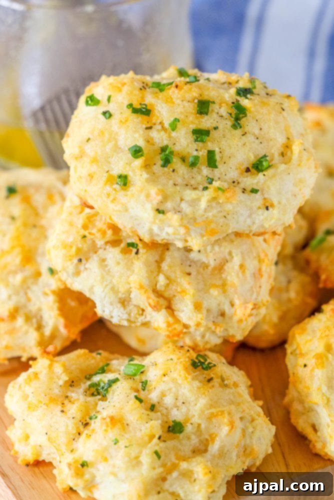 Whip Up Irresistible Cheesy Garlic Biscuits 6 cheddar bay drop biscuit on a cutting board