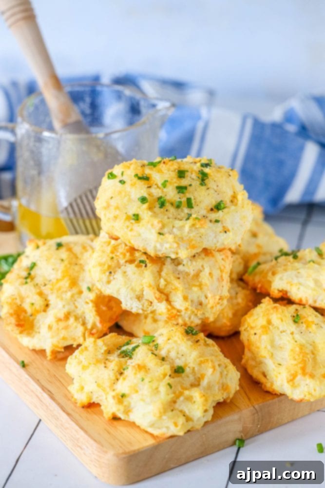 Whip Up Irresistible Cheesy Garlic Biscuits 4 cheddar bay drop biscuit on a cutting board