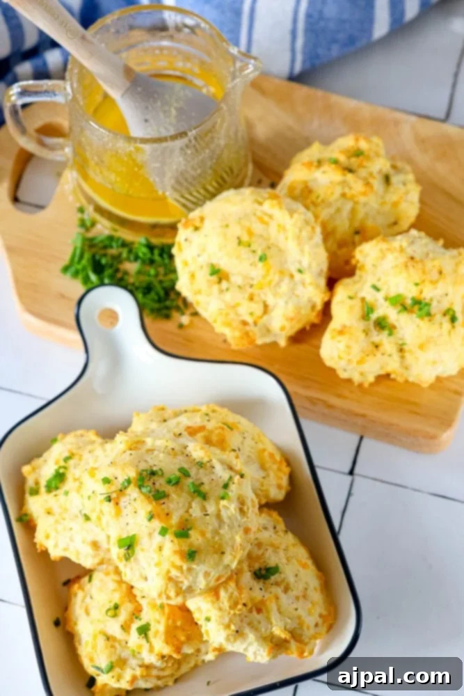 Whip Up Irresistible Cheesy Garlic Biscuits 5 cheddar bay drop biscuit on a cutting board
