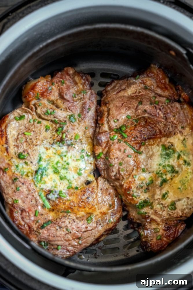Air Fryer Ribeye Perfection 3 Close-up of a juicy Air Fryer Ribeye Steak, cooked to a perfect medium-rare, showcasing its delicious crust.