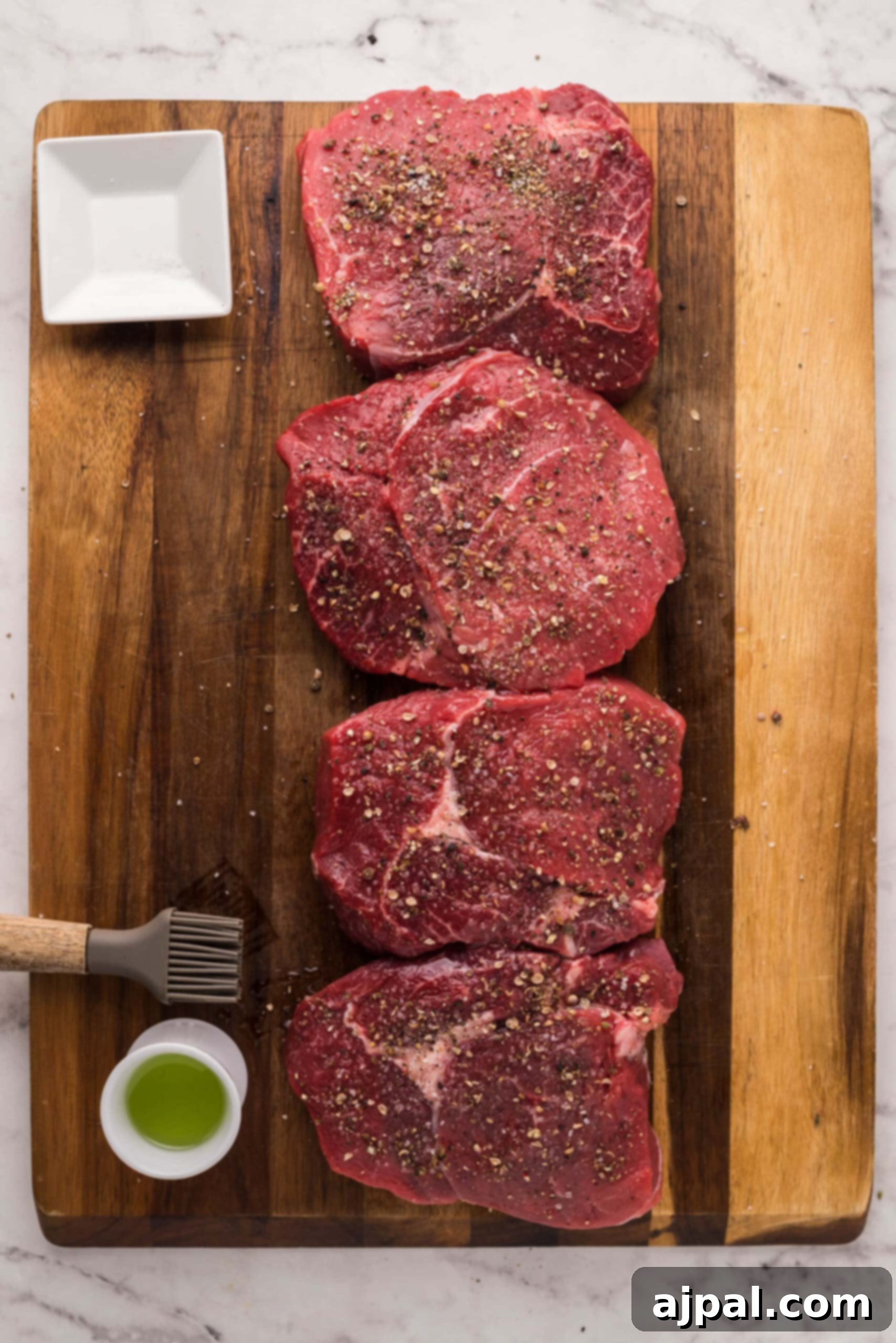 Air Fryer Ribeye Perfection 4 A succulent ribeye steak, seasoned and ready for the air fryer, presented on a cutting board.