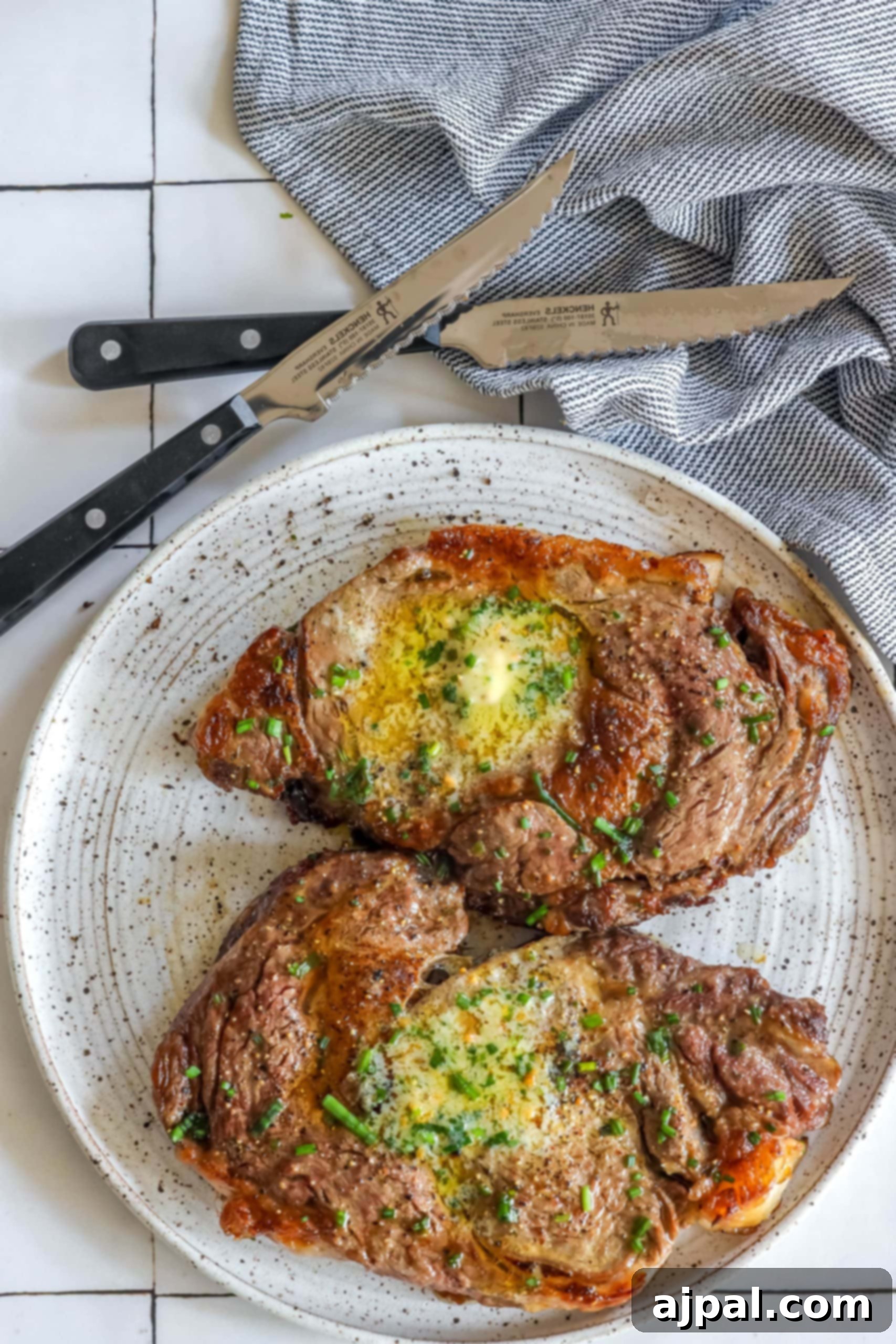 Air Fryer Ribeye Perfection 8 A sliced air-fried ribeye steak, revealing its juicy interior, served on a plate ready to be enjoyed.
