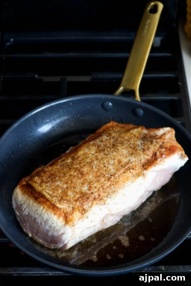 picture of pork loin browning in pan