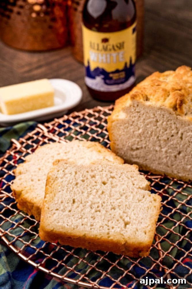 The best beer bread, baked with an easy recipe, placed on a wire rack, ready to be sliced and enjoyed.