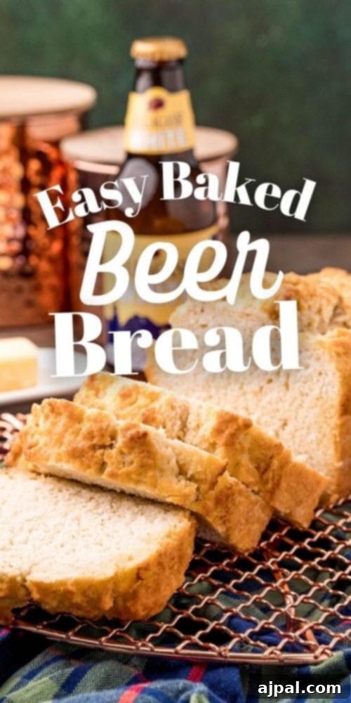 A beautifully baked beer bread on a cooling rack, positioned in front of a bottle of beer, emphasizing its homemade appeal.