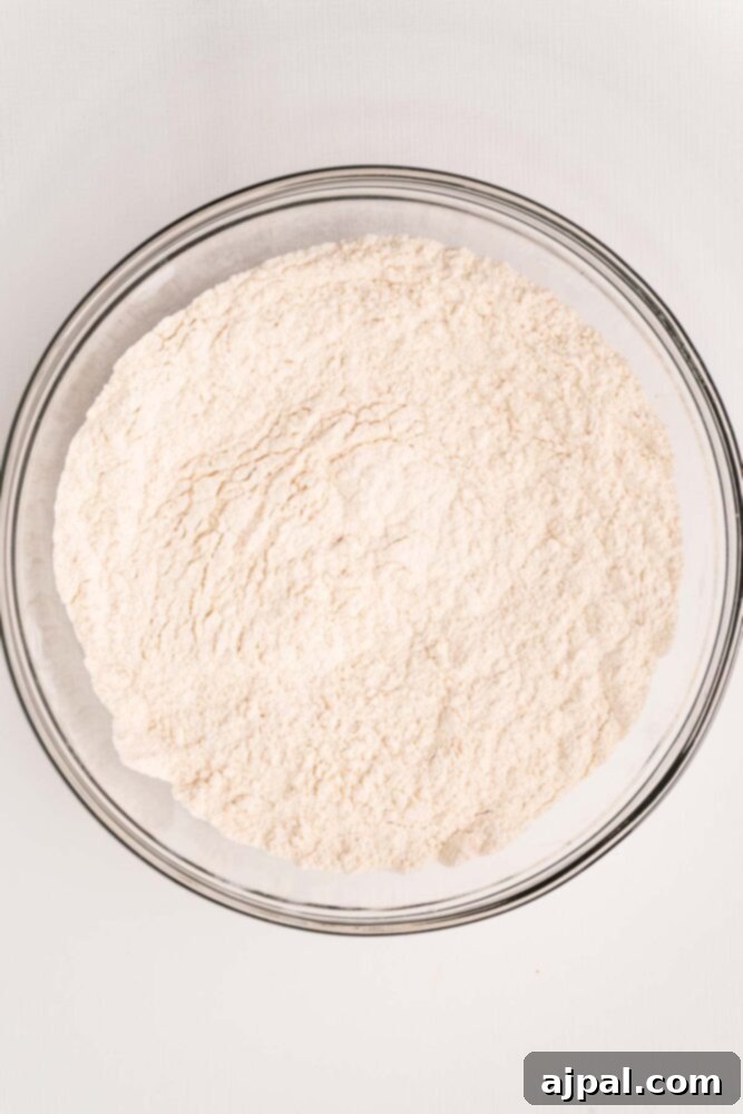 All-purpose flour precisely measured and ready in a mixing bowl for the beer bread recipe.