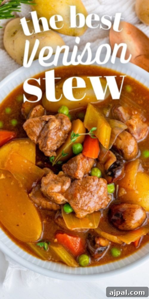 A rustic overhead shot of The Best Venison Stew in a Dutch oven, garnished with fresh herbs, ready for serving.