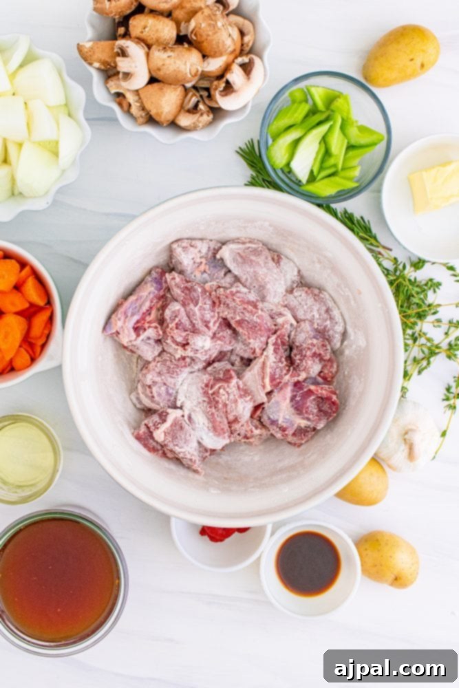 Cubes of deer meat being tossed with flour in a bowl, preparing them for browning and thickening the stew.