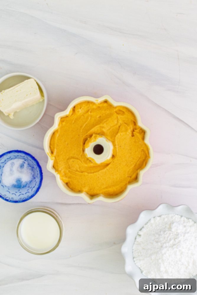 Perfect Air Fryer Pumpkin Bundt Cake 11 Smooth pumpkin bundt cake batter, evenly distributed in a fluted bundt pan, ready for baking.