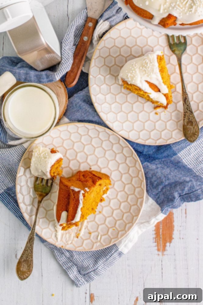 Perfect Air Fryer Pumpkin Bundt Cake 3 A delicious slice of air fryer pumpkin bundt cake, drizzled with creamy icing, presented on a white plate.