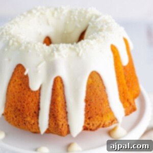 picture of air fryer pumpkin bundt cake on a white cake stand