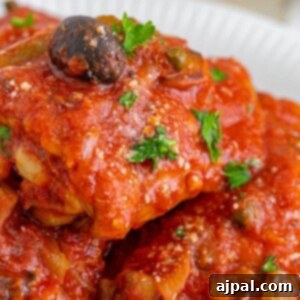Simple Steps to Perfect Chicken Cacciatore 19 picture of chicken cacciatore piled on a white plate