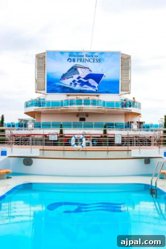 Cruising Post-Pandemic: A Reality Check 3 picture of majestic princess tv screen saying welcome back princess above a pool