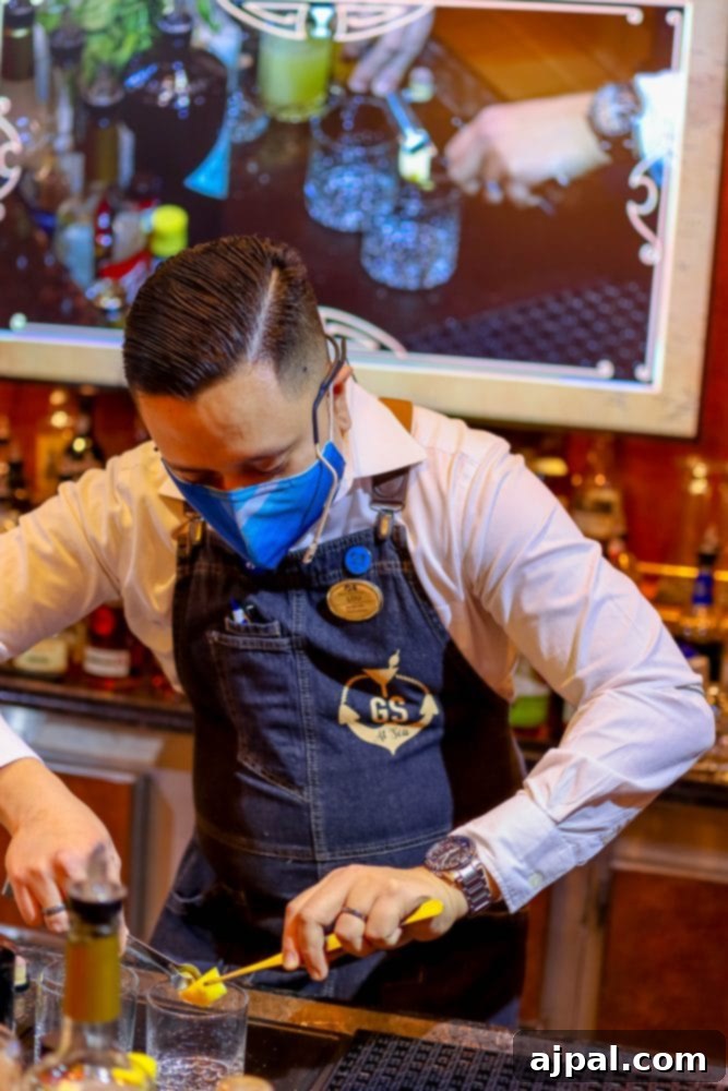 Cruising Post-Pandemic: A Reality Check 5 picture of a bartender at Good Spirits bar on Majestic Princess cruise ship in a face mask