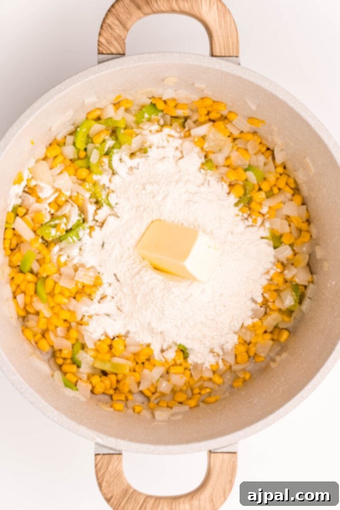Creamy Corn Chowder 7 Butter sizzling in a pan, preparing for the next step of making a creamy corn chowder with chicken.