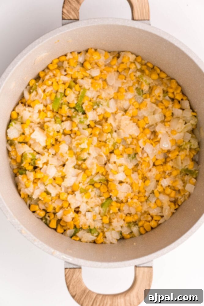 Creamy Corn Chowder 10 Fresh corn on the cob, a key ingredient, resting in a pan before being added to the chowder.