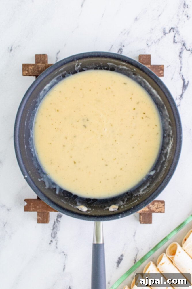 Melted butter combined with flour and ranch seasoning, forming a roux in a small saucepan.