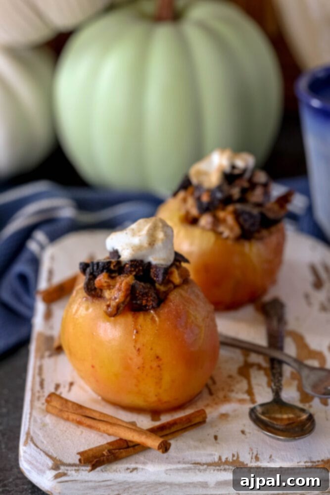 Simple Baked Apples with Figs 11 picture of baked apple on a plate topped with figs and whipped cream