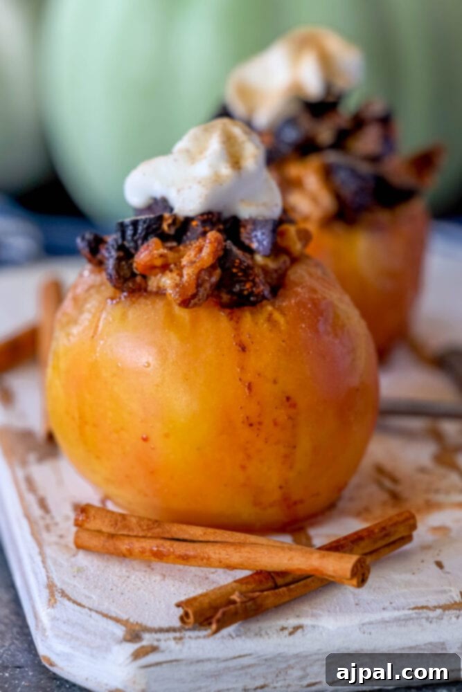 Simple Baked Apples with Figs 3 picture of baked apple on a plate topped with figs and whipped cream