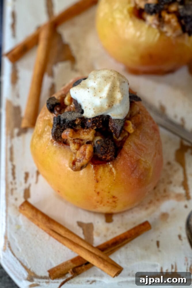 Simple Baked Apples with Figs 12 picture of baked apple on a plate topped with figs and whipped cream