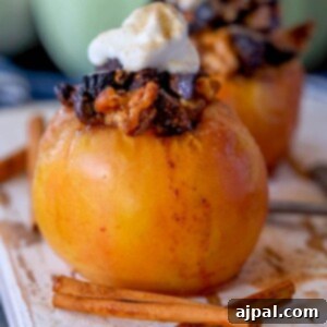 Simple Baked Apples with Figs 14 picture of baked apple on a plate topped with figs and whipped cream