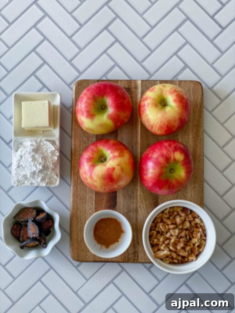 Simple Baked Apples with Figs 5 picture of confectioners sugar, apples, butter, cinnamon, walnuts, and figs on a table