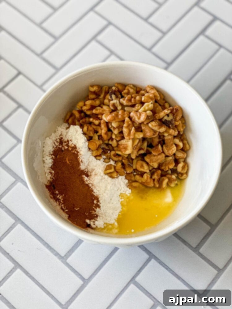 Simple Baked Apples with Figs 7 picture of confectioners sugar, butter, cinnamon, and walnuts in a bowl