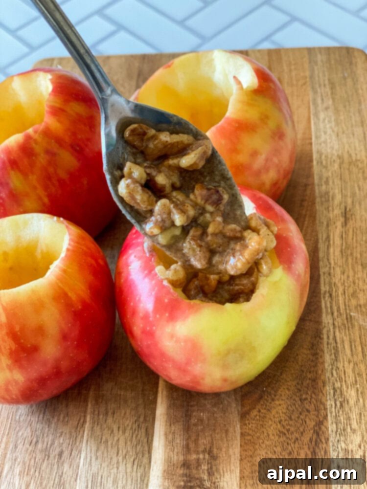 Simple Baked Apples with Figs 9 picture of spoon filling apple with stuffing mixture