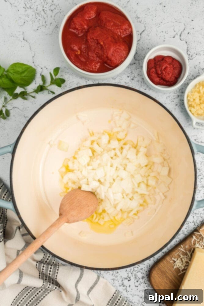 Sautéing onions in a pot for soup base