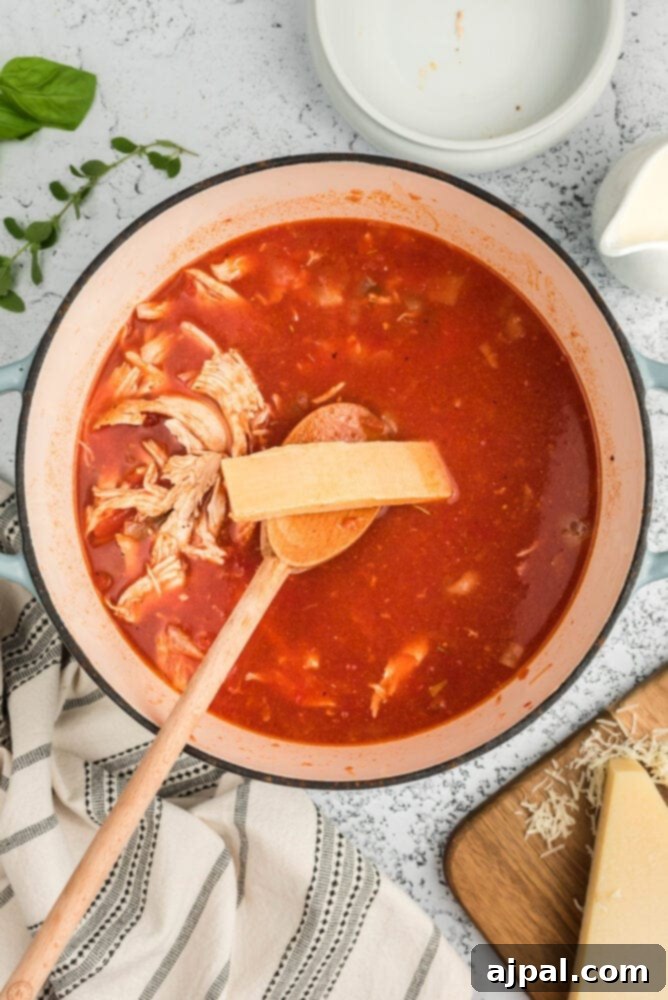 Tortellini added to the simmering soup