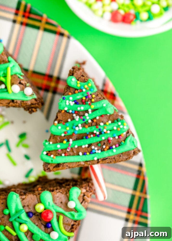 Festive Fudgy Evergreen Brownies 2 A beautifully decorated Christmas tree brownie on a plate, ready to be enjoyed.