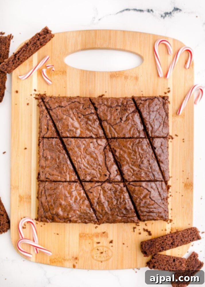 Festive Fudgy Evergreen Brownies 11 Brownie strips further sliced to create the diagonal cuts needed for the Christmas tree shapes, illustrating the cutting technique.