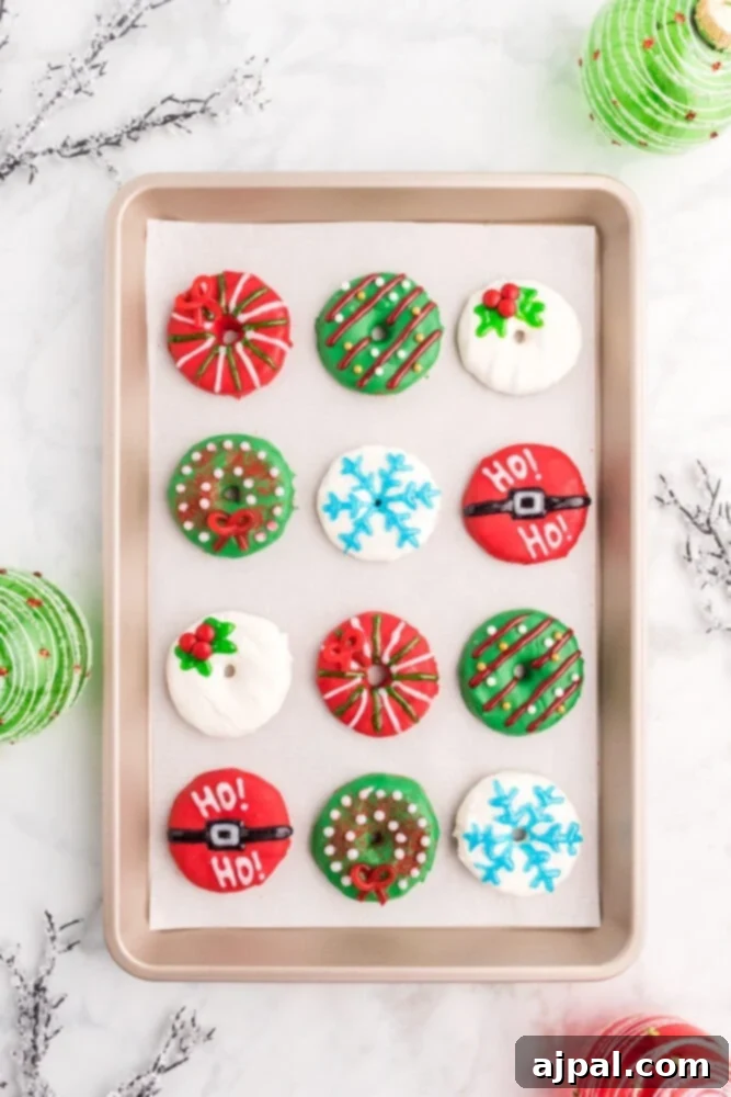 Effortless Christmas Wreath Cookies 2 Beautifully decorated Christmas wreath cookies with festive sprinkles and edible glitter, ready for the holidays.