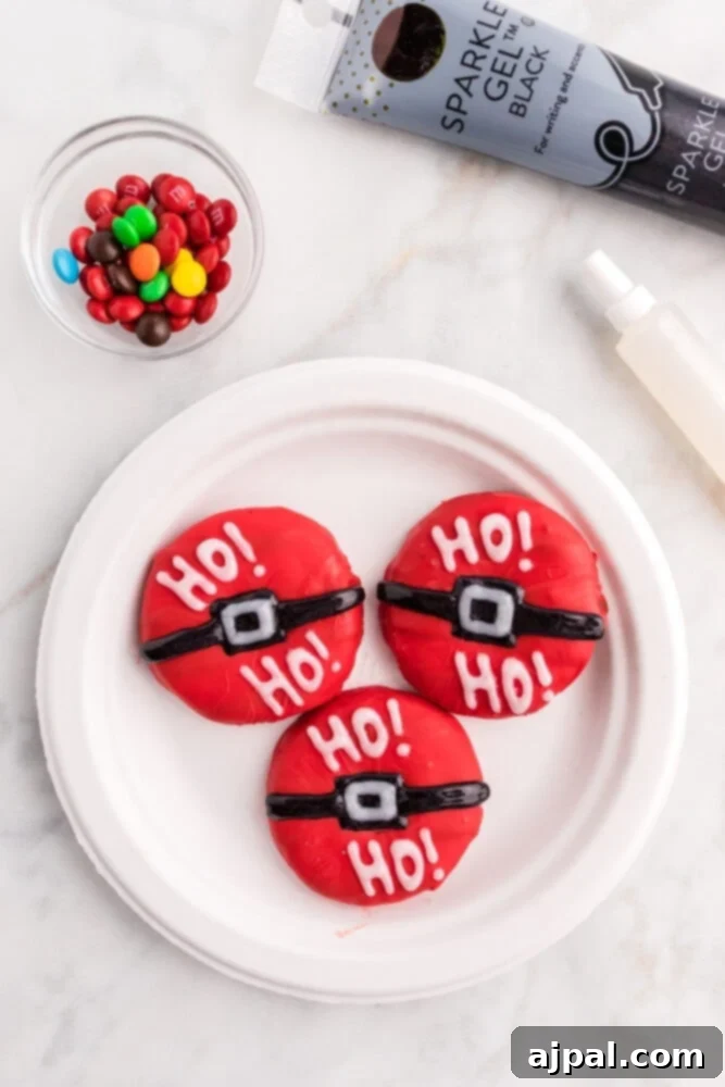 Effortless Christmas Wreath Cookies 14 A vibrant red Christmas wreath cookie adorned with bold alternating green and white glitter gel stripes, finished with a charming licorice bow.