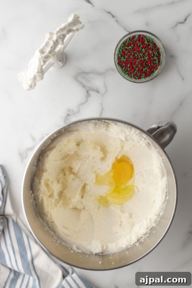 picture of creamed butter and sugar in the bowl of a stand mixer