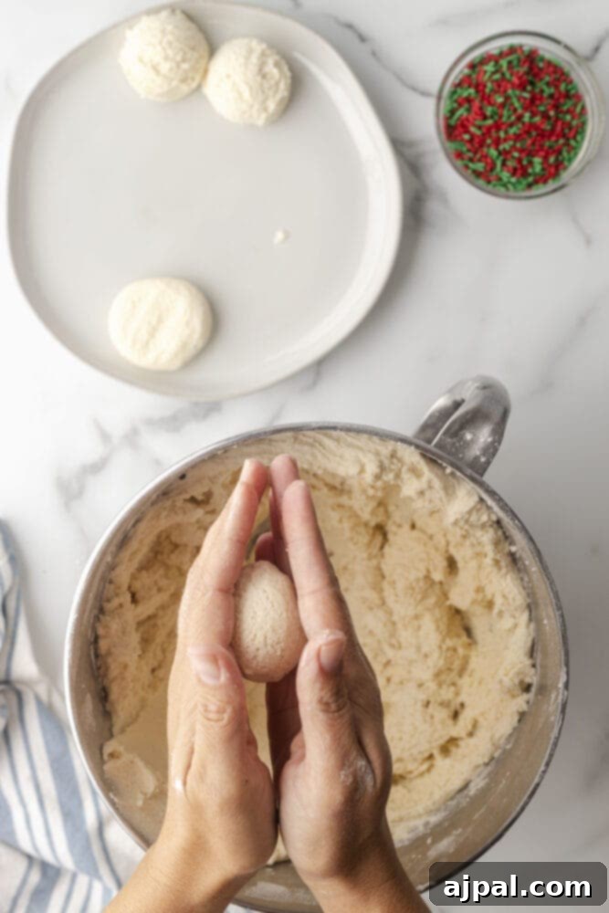 picture of hand flattening cookie dough