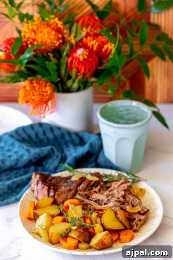Ultimate Comfort Pot Roast with Tender Potatoes 4 A perfect pot roast and potatoes dish, freshly served on a rustic table.